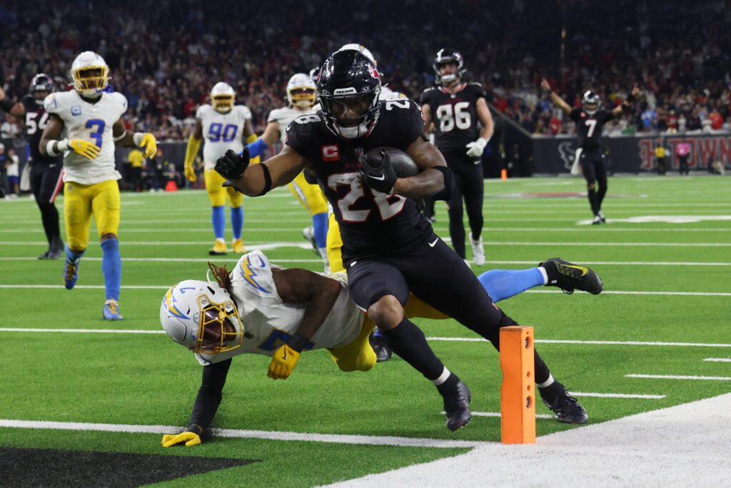 Houston Texans running back Joe Mixon (28) scores a touchdown against the Los Angeles Chargers in the fourth quarter in an AFC wild card game at NRG Stadium
