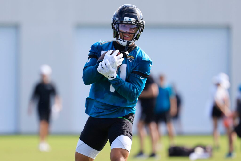 Jacksonville Jaguars wide receiver Parker Washington (11) runs the ball during the third day of minicamp at the Miller Electric Center