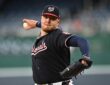 Washington Nationals pitcher Cade Cavalli comes through his delivery with the ball in his right hand.