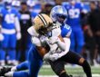New Orleans Saints wide receiver Chris Olave is wrapped up from behind by Detroit Lions cornerback Rock Ya-Sin.