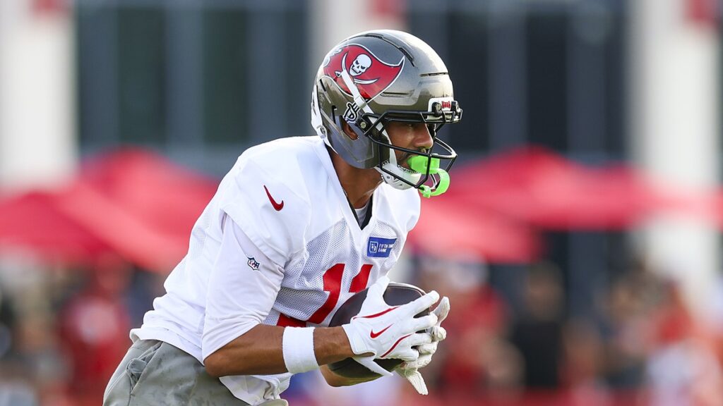 Tampa Bay Buccaneers wide receiver Jalen McMillan secures a pass in both hands during a training camp drill.