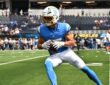 Los Angeles Chargers wide receiver Ladd McConkey tucks the ball after a catch during pregame warmups.
