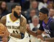 New Orleans Pelicans guard Saddiq Bey protects the ball as Sacramento Kings guard Daeqwon Plowden defends him.